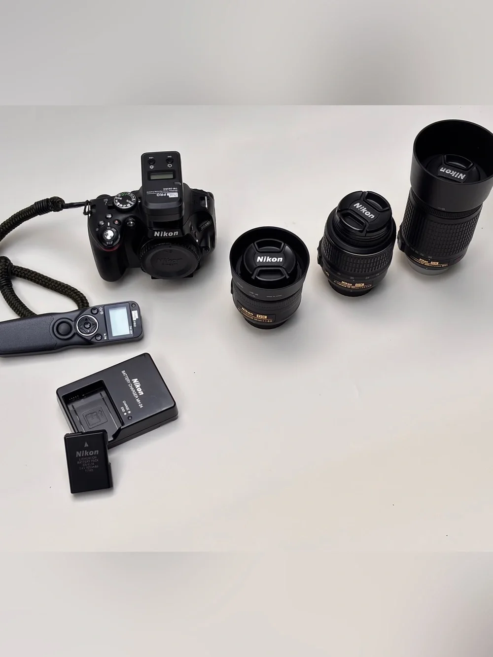 Nikon Black DSLR Camera Body with Black Lenses and Accessories